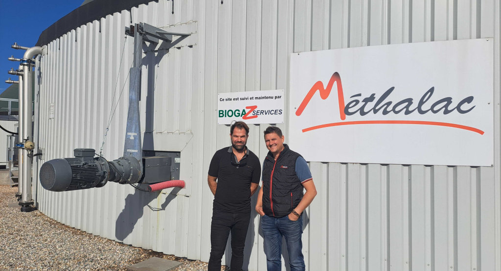 Visual - A photo of Alexandre Lapierre from BiogasWorld and one of Methalac's employees in front of a biogas plant.
