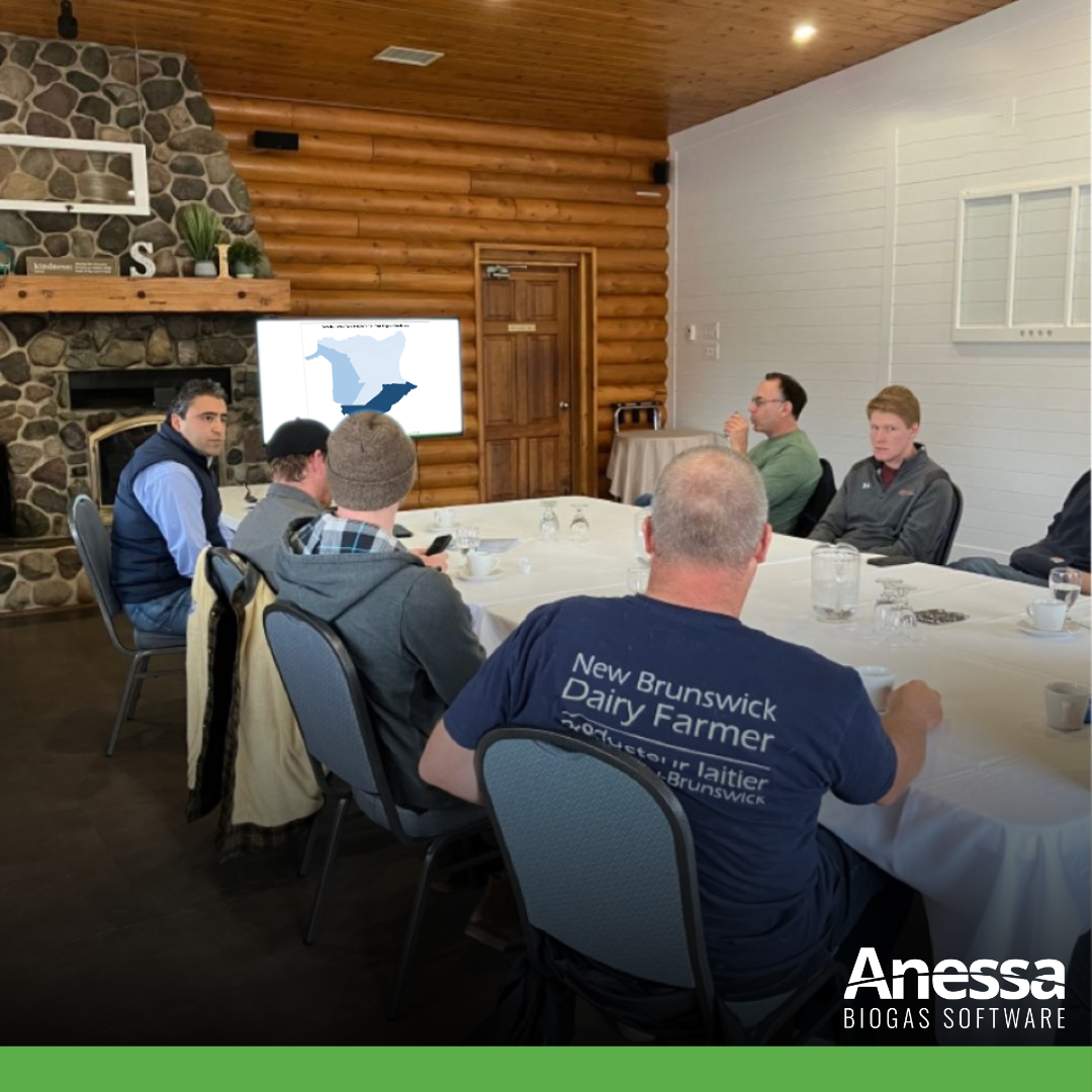Picture - Anessa's team are discussing around a table.